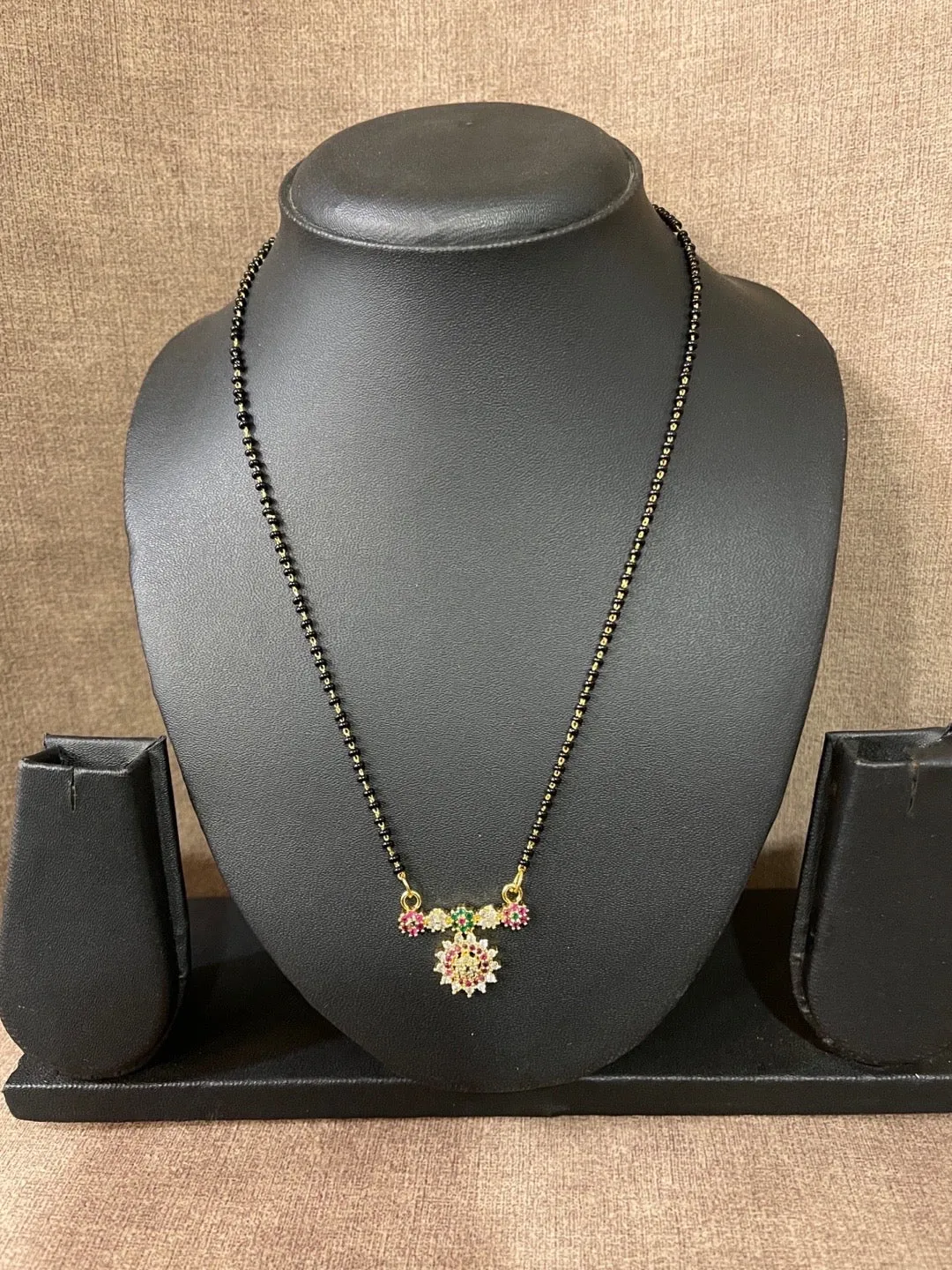 Short Trendy Mangalsutra Designs American Diamond Multi Color Flower Pendant Black Beads Chain