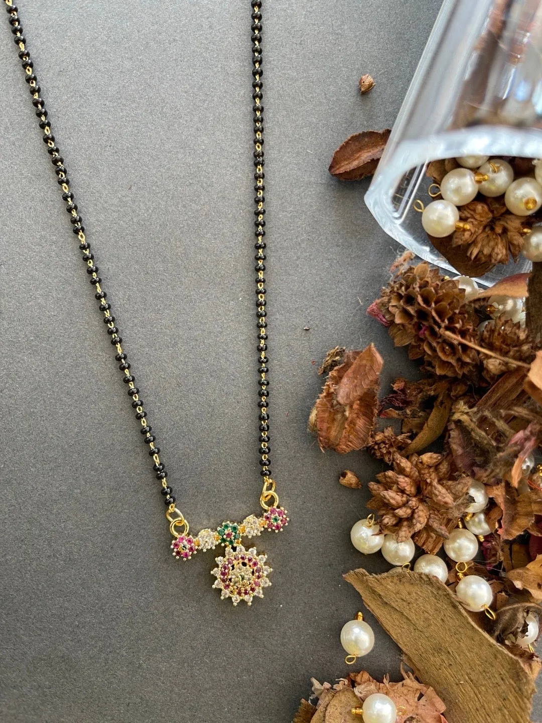 Short Trendy Mangalsutra Designs American Diamond Multi Color Flower Pendant Black Beads Chain